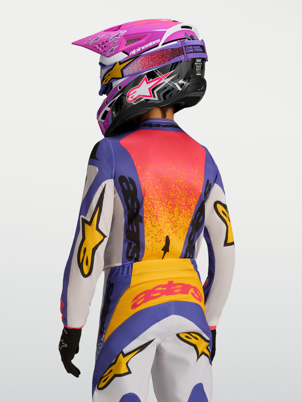 Alpinestars 2027 Youth Fluid Drag Jersey, motocross racing jersey, purple and orange colors, moisture-wicking textile.