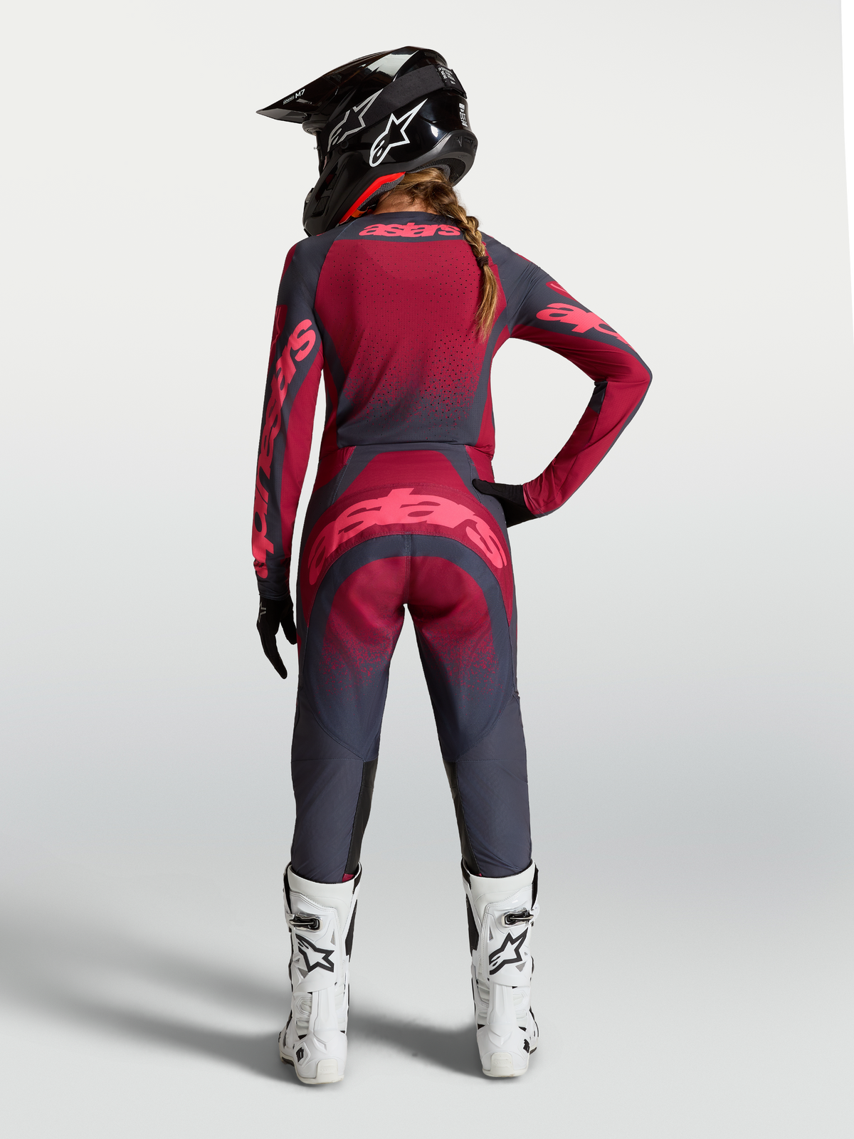 Alpinestars Stella Techstar Swan Gear Set AND Pants, women's motocross outfit in dark gray and crimson red, rear view.