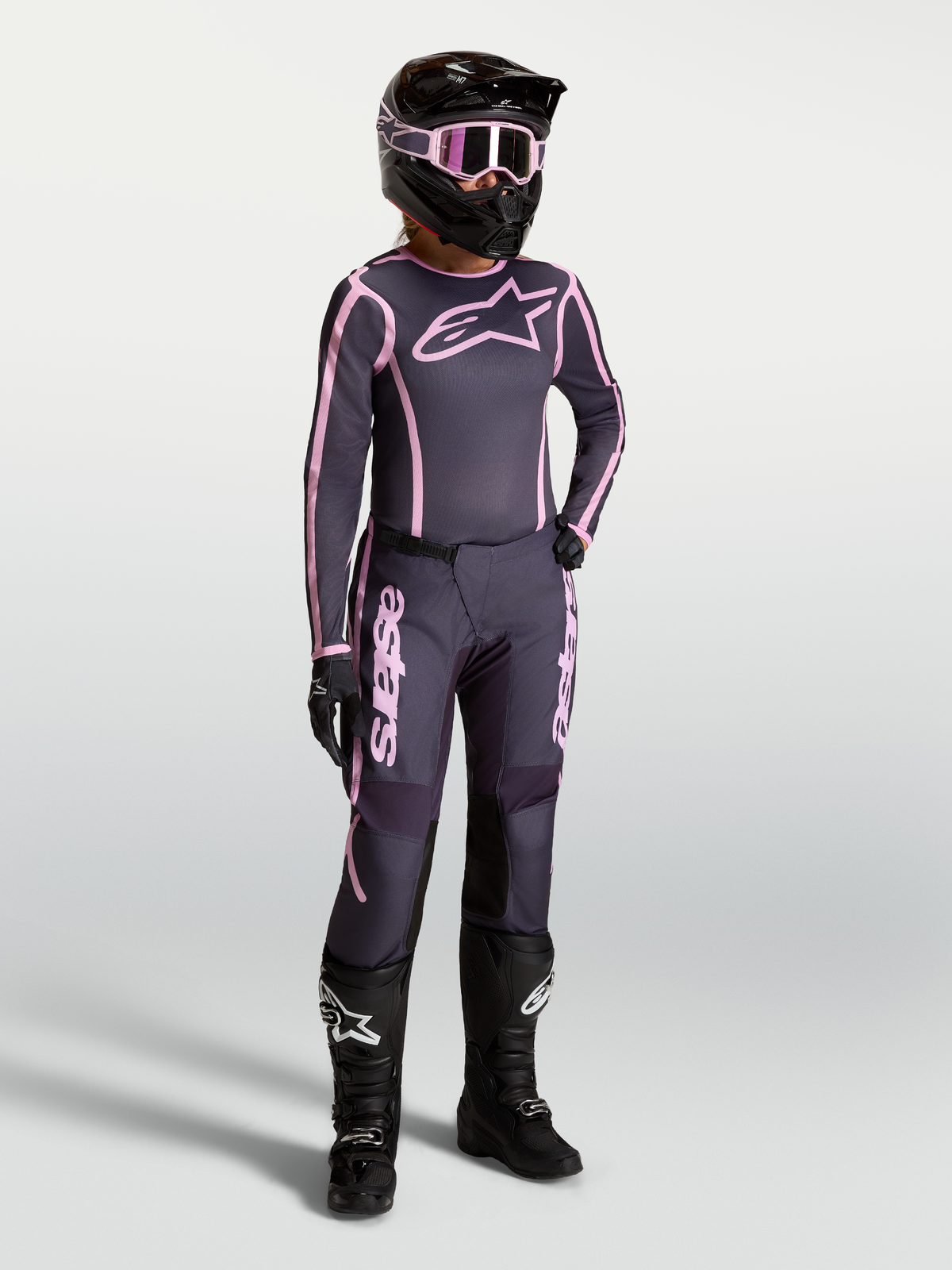 Alpinestars Stella Fluid Apex V2 Jersey and Gear Set, Women's Motocross Outfit in Graystone and Pink with black racing boots.