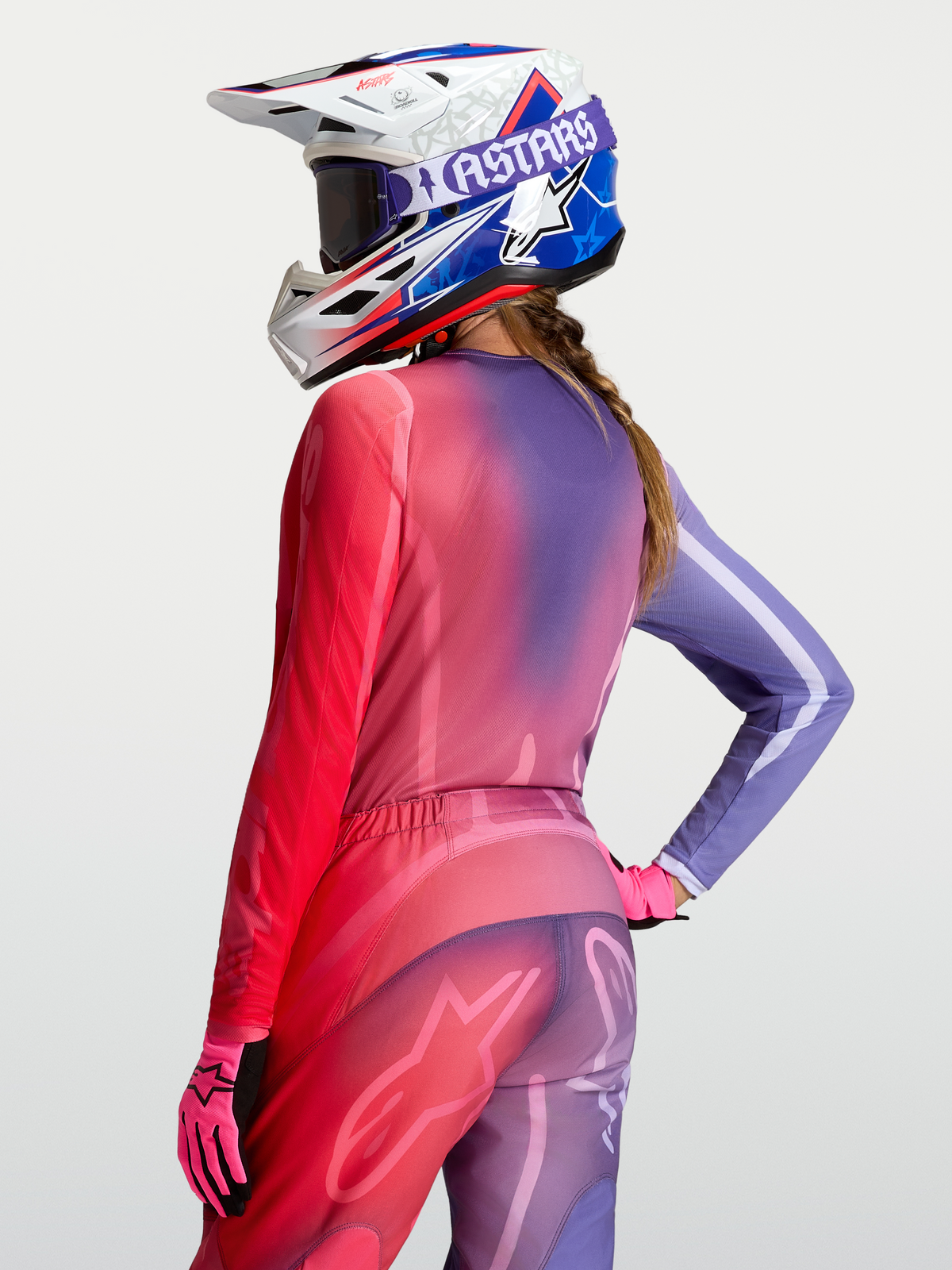 Alpinestars Stella Fluid Kepler Jersey, women's motocross gear, purple and rouge red gradient polyfabric with a relaxed fit and extended rear hem.