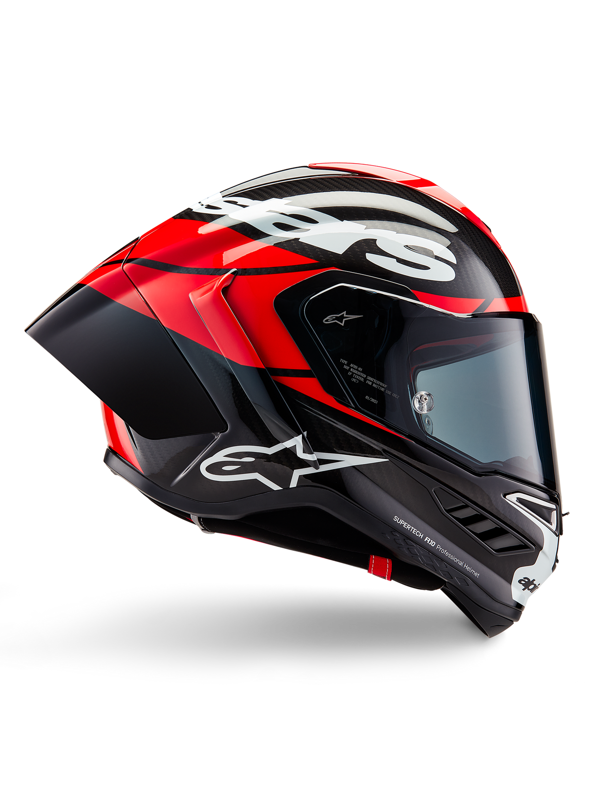 Alpinestars Supertech R10 Element Helmet, Full-face motorcycle racing helmet, Black Carbon with Bright Red and White accents, side profile showing aerodynamic carbon fiber shell, glossy finish with white logo, tinted visor, professional racing protection