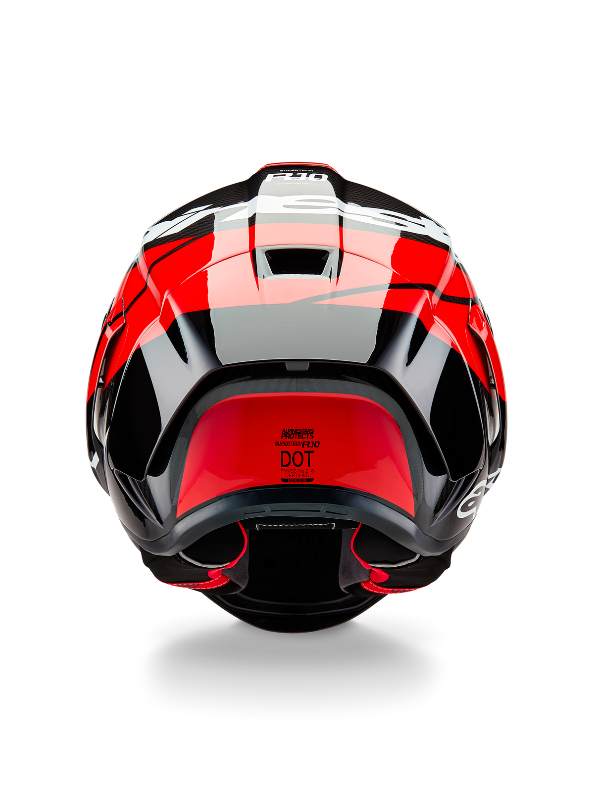 Alpinestars Supertech R10 Element Helmet, rear view, Black Carbon with Bright Red and White Glossy accents, featuring an aerodynamic rear spoiler, exhaust vents, and DOT certification label, sleek racing-inspired design with carbon fiber detailing