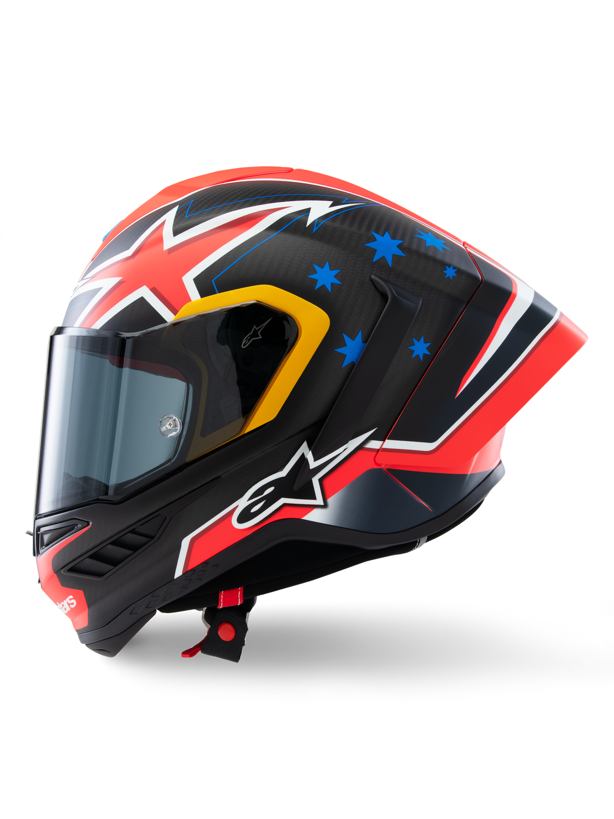 Alpinestars Supertech R10 Miller Limited Edition Helmet, side profile, Carbon Red Matt finish with visible carbon fiber weave, featuring red and white lightning graphics, blue stars on the rear, yellow accents around the visor, and white Alpinestars logo, high-performance racing motorcycle helmet