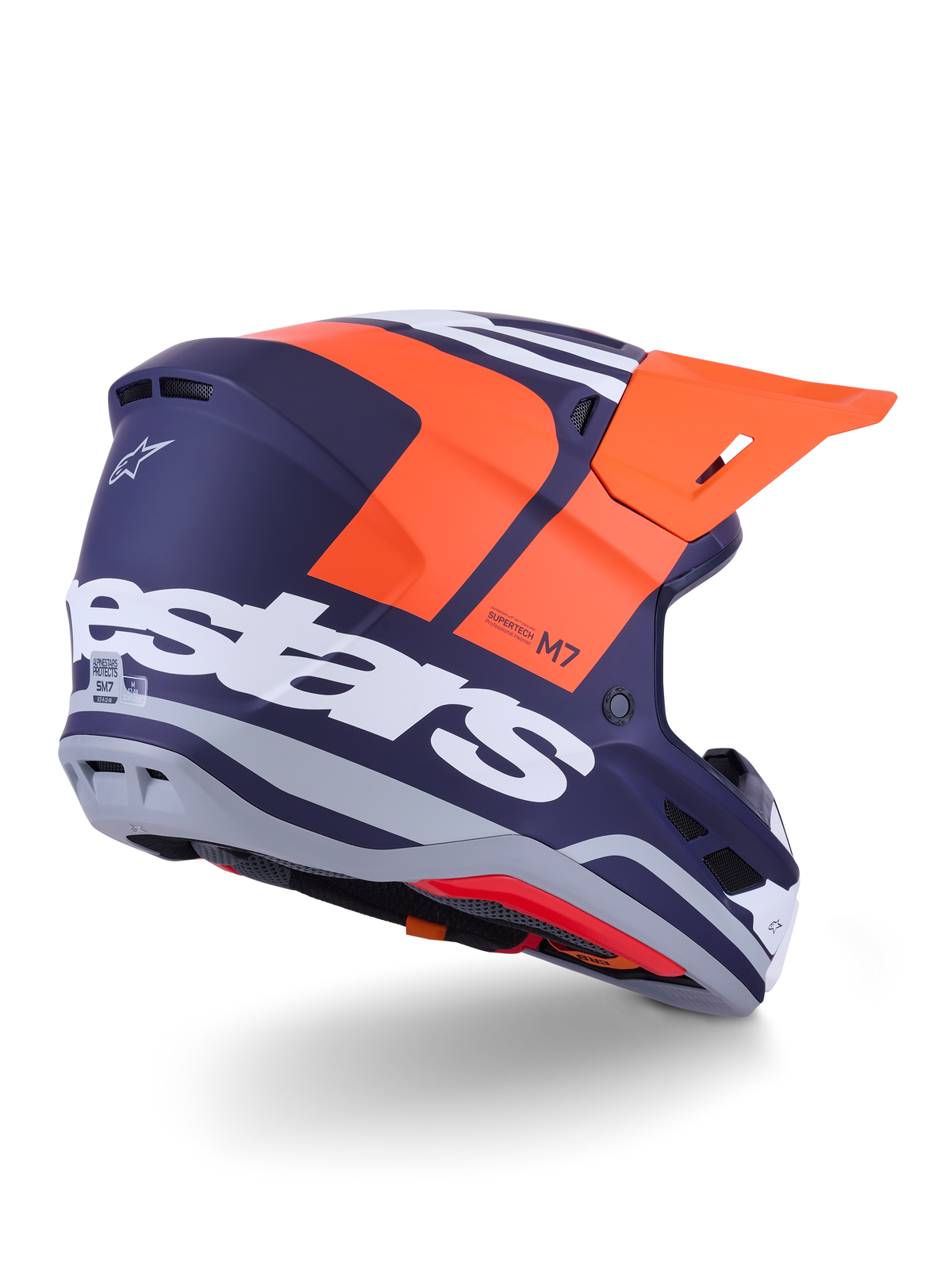 Alpinestars S-M7 Core Helmet, Motocross Helmet, Orange and Blue Matt, rear-side view featuring bold white Alpinestars branding across the back, bright orange visor, aerodynamic composite shell with grey accents, professional off-road racing protection
