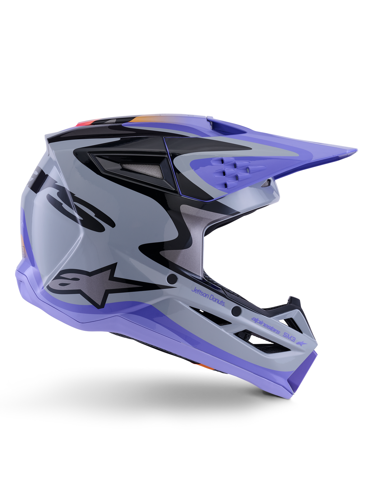 Alpinestars S-M3 Jettson Helmet ECE 22.06, Motocross Helmet, Gray Purple and Black Glossy, side profile view featuring a purple visor and chin guard, sleek aerodynamic shell with black graphics, multiple ventilation ports, and "Jettson Donuts" branding on the side.