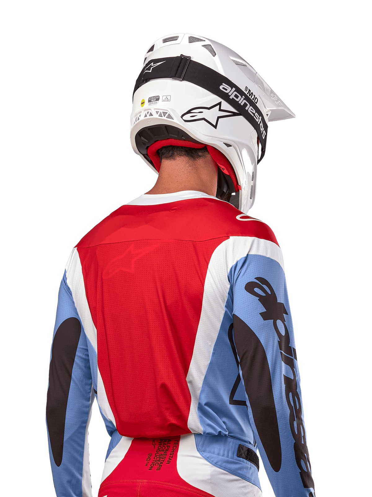 Alpinestars 2024 Techstar Ocuri Jersey, Motocross Jersey, Light Blue, Mars Red and White, rear view of rider wearing matching white helmet and black goggles, features bold black branding on sleeves and ergonomic race fit for off-road performance