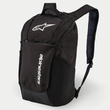 Alpinestars Defcon V2 Backpack, Daily Backpack, Black, featuring white printed logo and vertical Alpinestars branding, front zipper pocket, side mesh pockets, and padded airmesh shoulder straps, durable 600D polyester construction