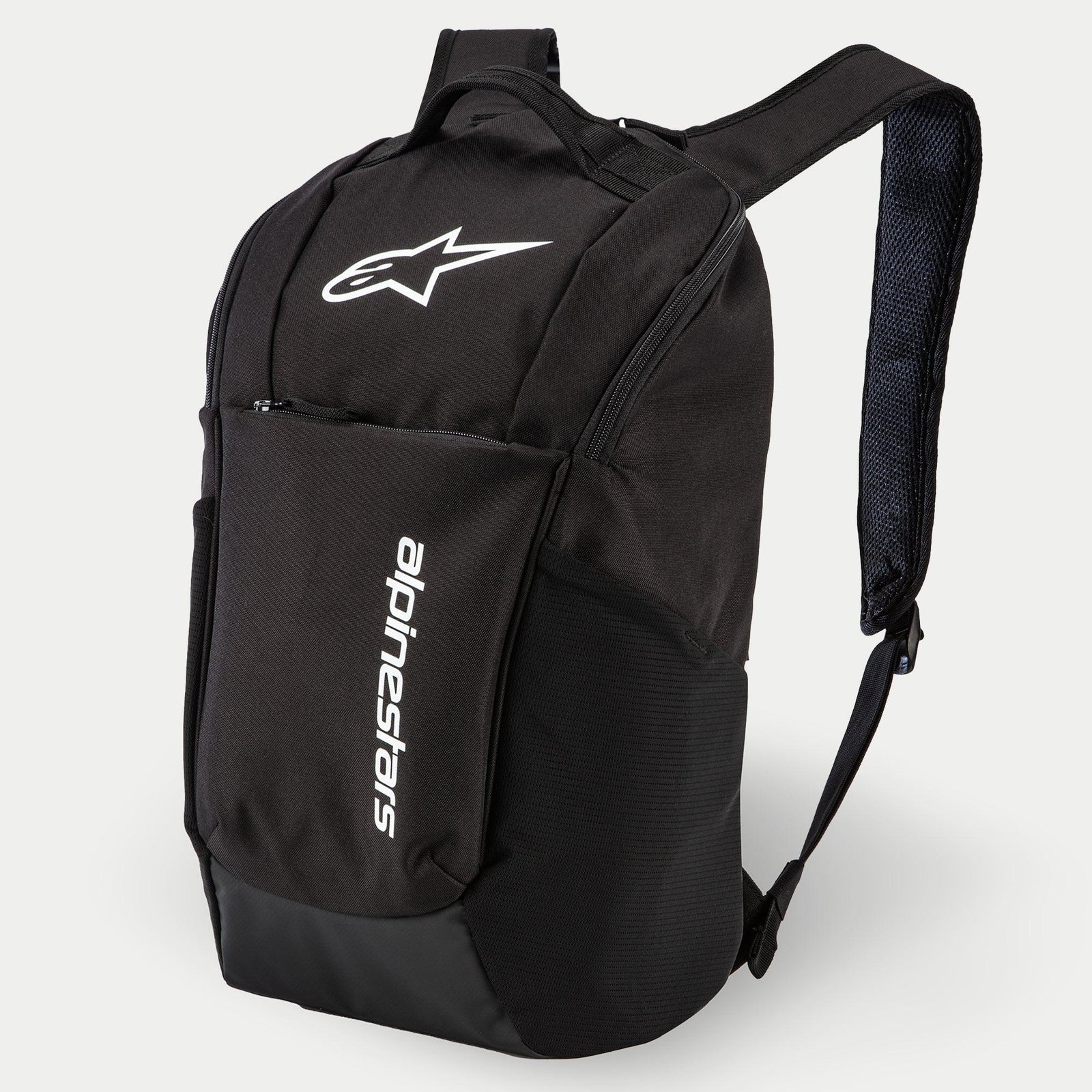 Alpinestars Defcon V2 Backpack, Daily Backpack, Black, featuring white printed logo and vertical Alpinestars branding, front zipper pocket, side mesh pockets, and padded airmesh shoulder straps, durable 600D polyester construction
