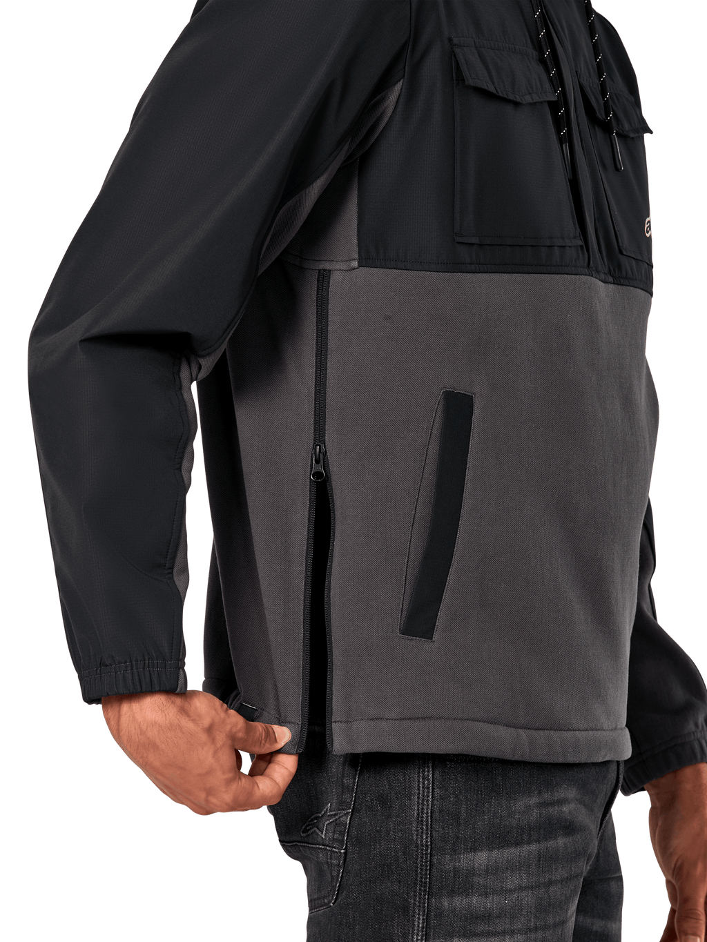 Alpinestars Juncture Hybrid Jacket in Black Gunmetal, side detail view highlighting the side entry zipper and lower welt pocket, mixed-material design with grey canvas fleece and black ripstop overlays, casual motorsport-inspired streetwear