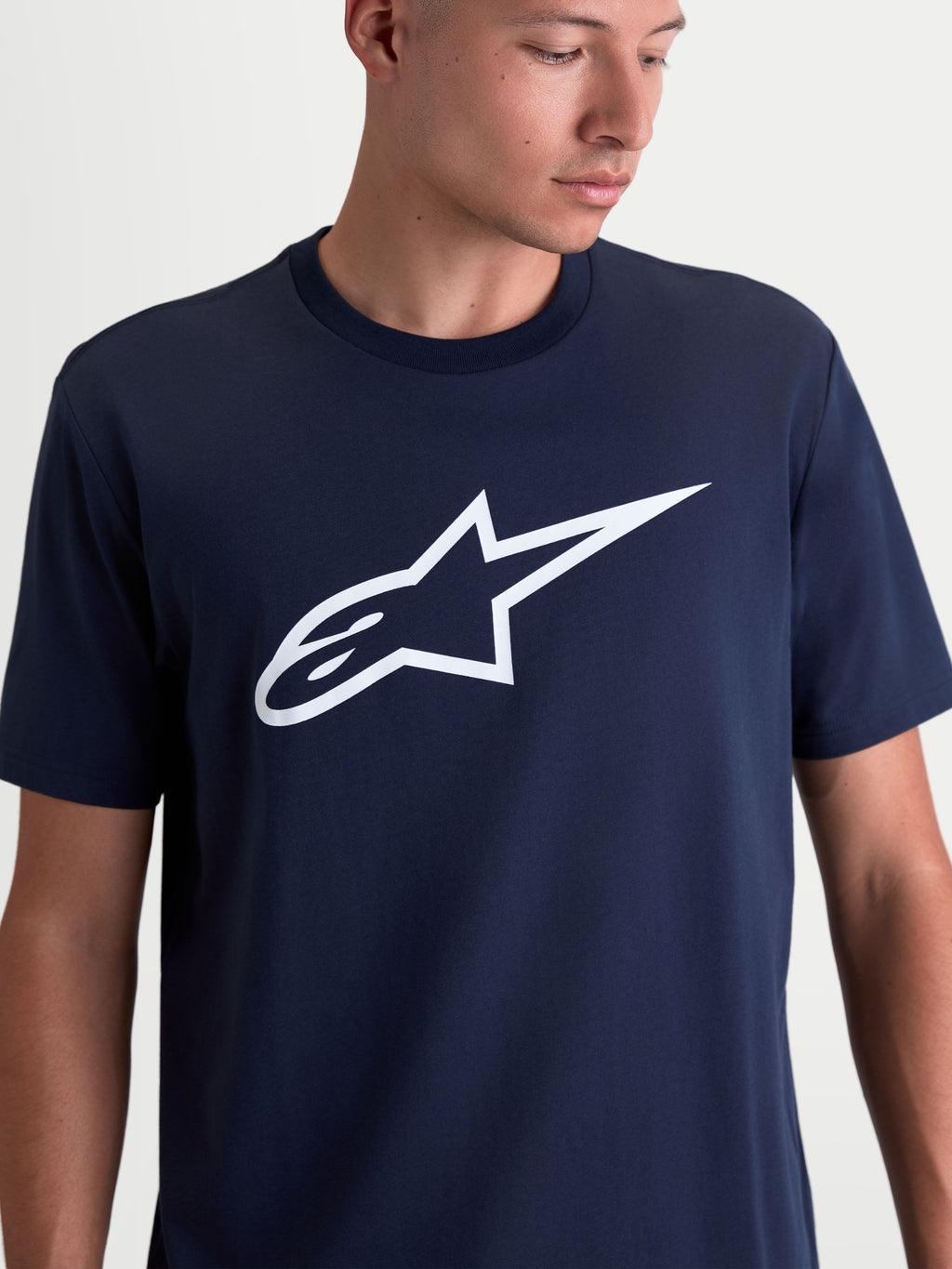 Alpinestars Ageless 2.0 CSF Tee, Men's Sportswear T-Shirt, Navy Blue with White Logo, featuring a soft-hand Ageless logo graphic on the chest, 60/40 cotton-poly blend, cut-and-sew fit for everyday wear.