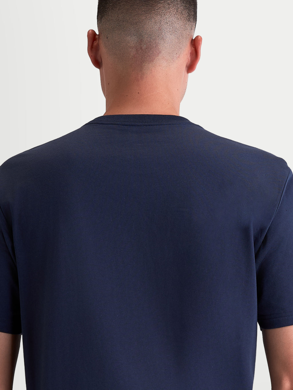 Alpinestars Ageless 2.0 CSF Tee, Navy Blue Sportswear T-Shirt, Unisex Casual Apparel, Back View on Model showing the cut-and-sew fit and premium cotton-poly blend construction.