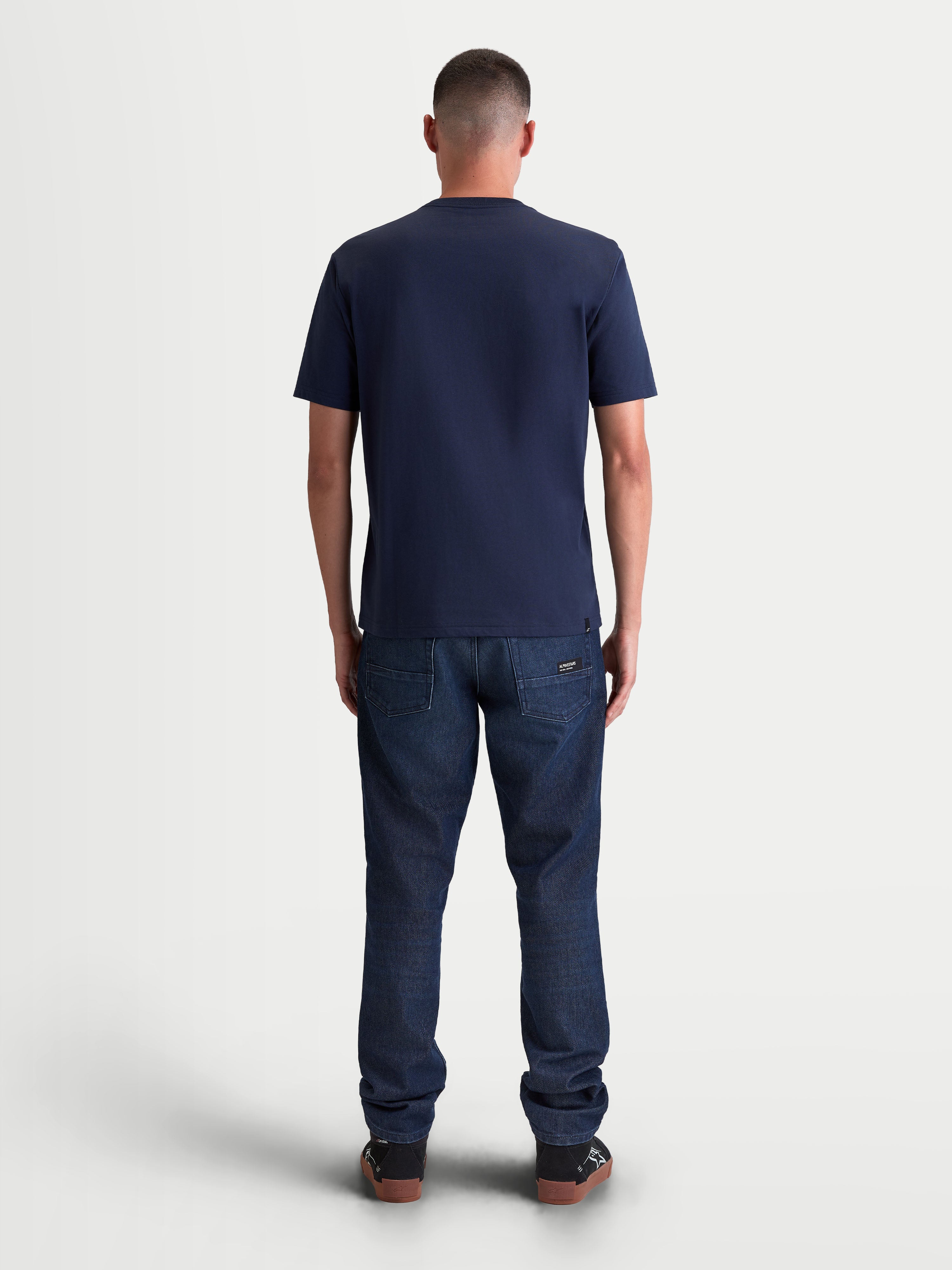 Alpinestars Ageless 2.0 CSF Tee, Men's Sportswear Short Sleeve T-Shirt, Navy Blue, rear view on-model showing the structured cut-and-sew fit and premium cotton-poly blend construction for everyday casual wear.