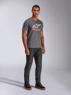 Alpinestars Always 2.0 CSF Tee, Short Sleeve T-Shirt, Charcoal Grey, White A-star Logo with Orange Branding, casual motorsport streetwear worn with dark jeans and black sneakers