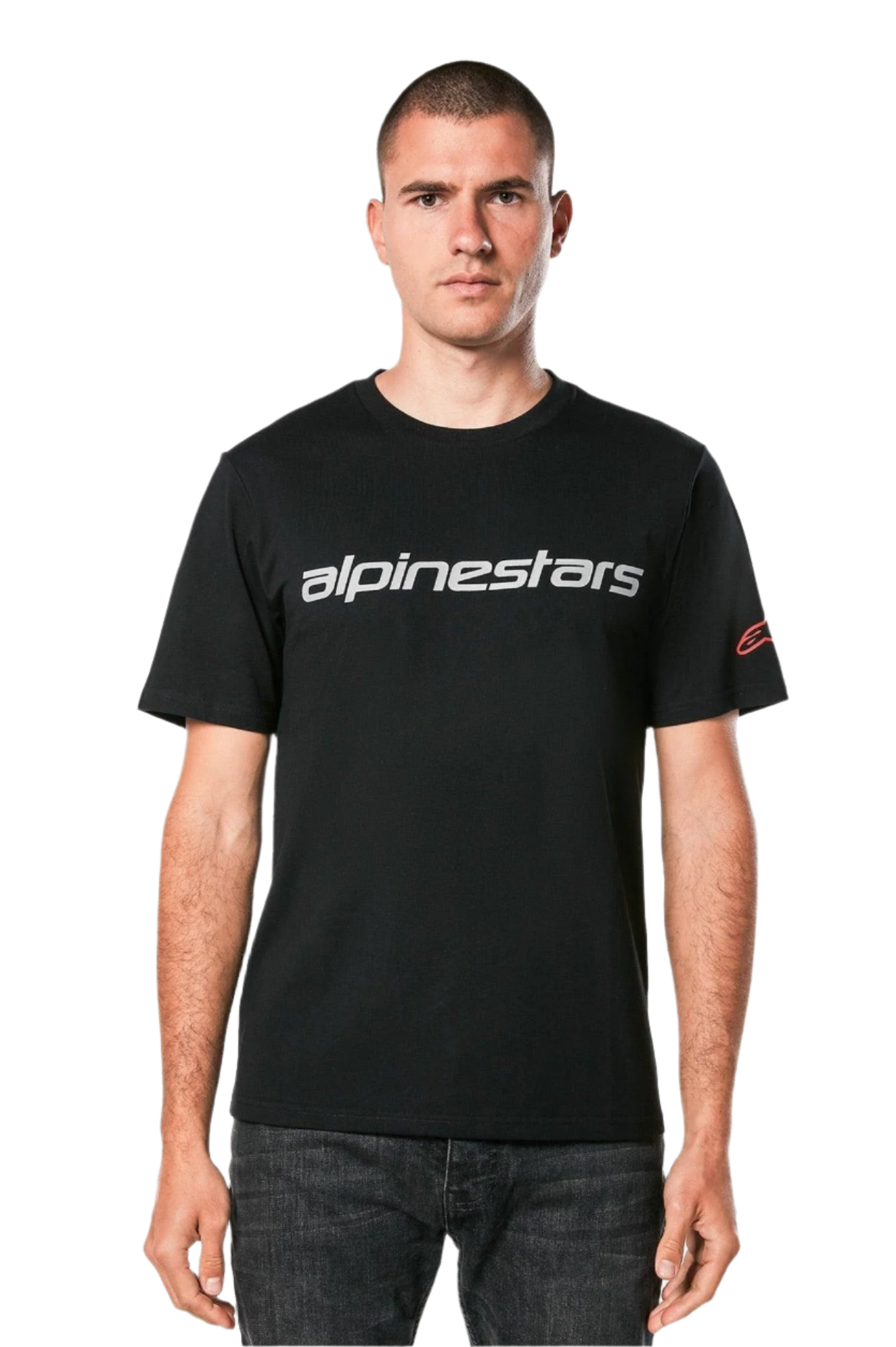 Alpinestars Linear Wordmark 2.0 CSF Tee, Short Sleeve T-Shirt, Black, Grey linear wordmark across the chest and red Ageless logo on the sleeve, worn by a model with dark jeans, casual motorsport-inspired streetwear
