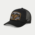 Alpinestars Heritage Patch Trucker Hat, Black, structured crown with curved bill, large front embroidered heritage patch with winged wheel and 'Racing Ahead Est. 1963', black mesh back panels with side star logo, casual motorsport lifestyle headwear