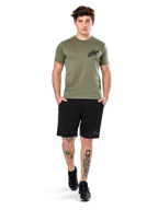 Alpinestars Attrition Performance Tee, Short Sleeve T-Shirt, Light Green, featuring a black Astars logo on the chest, worn with black athletic shorts and black sneakers, casual performance sportswear lifestyle shot