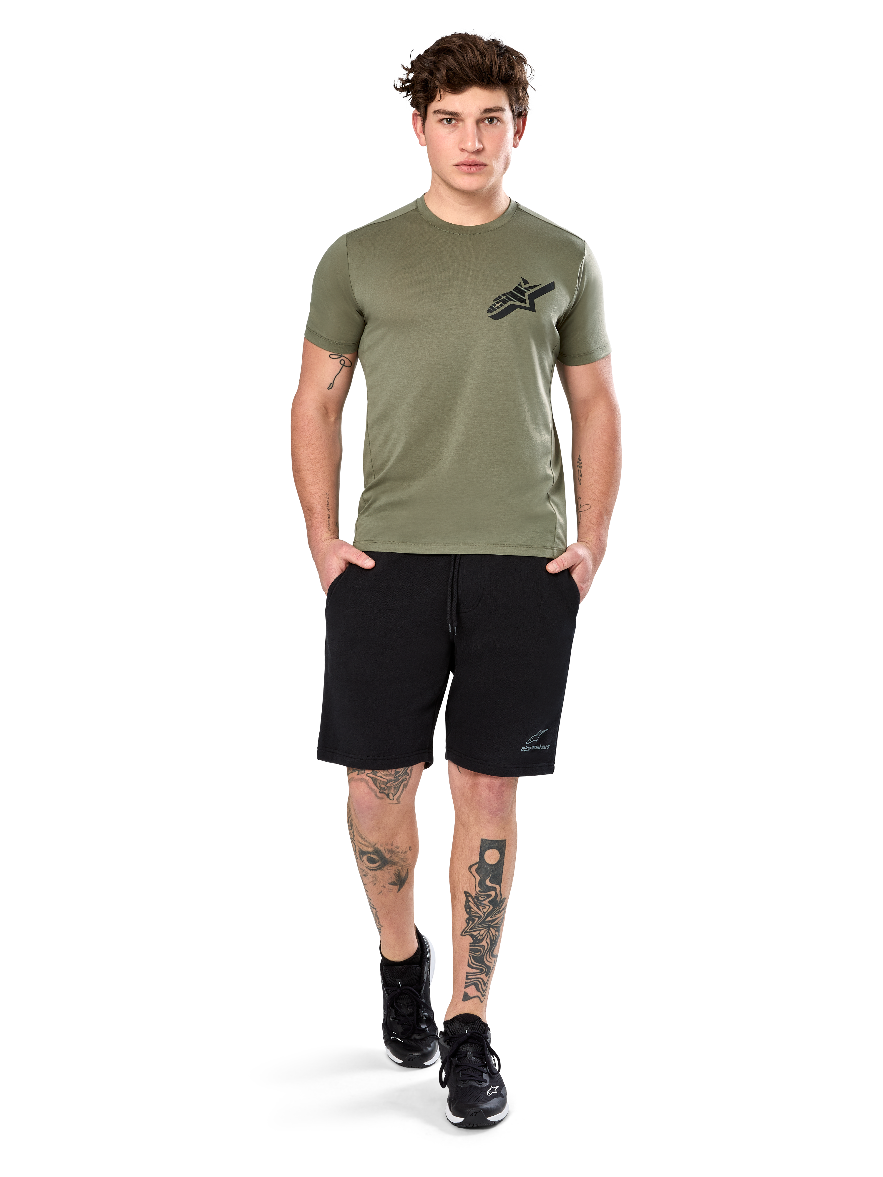 Alpinestars Attrition Performance Tee, Short Sleeve T-Shirt, Light Green, featuring a black Astars logo on the chest, worn with black athletic shorts and black sneakers, casual performance sportswear lifestyle shot