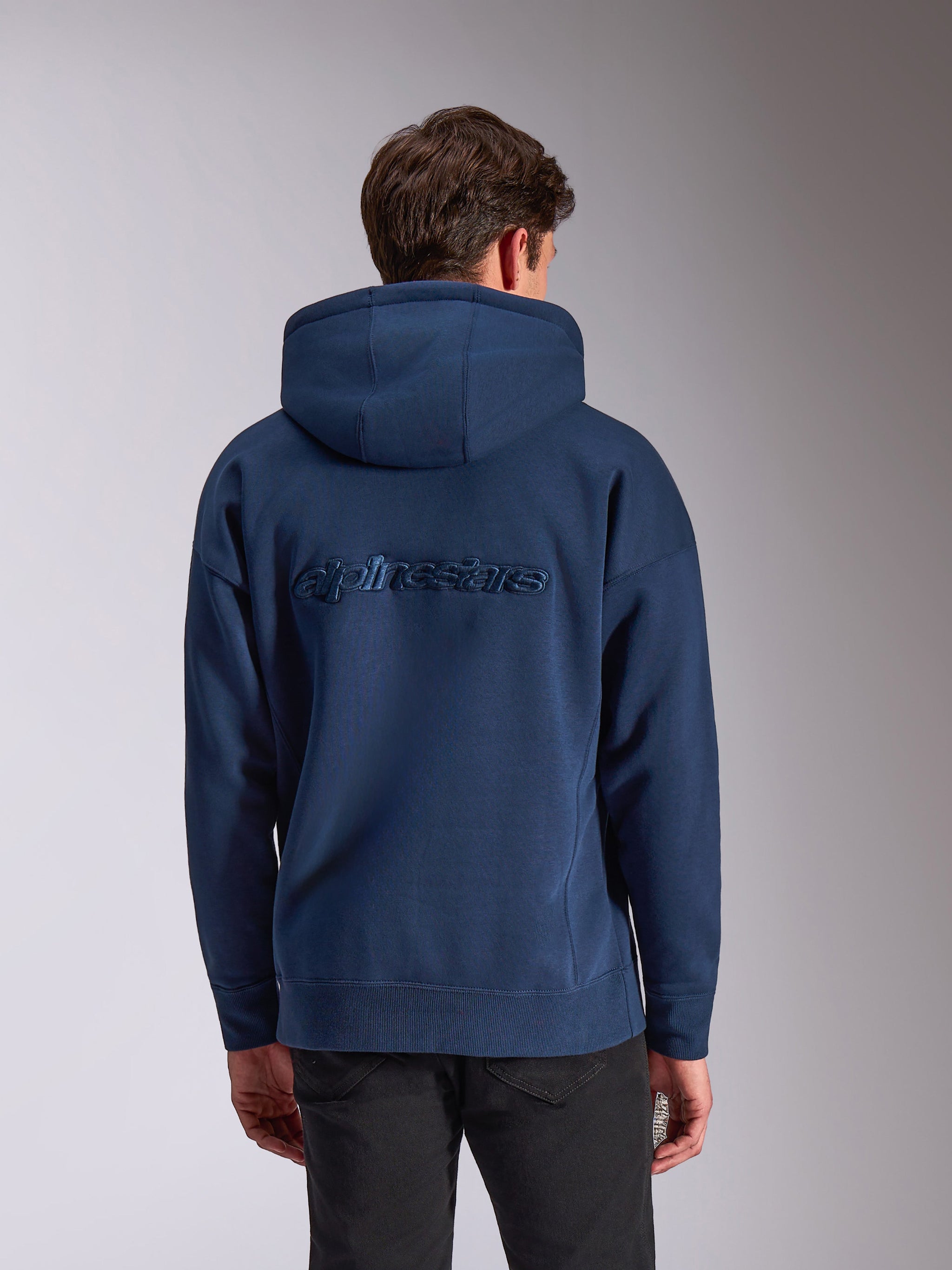 Alpinestars Emergent Oversized Hoodie, Navy Blue, rear view featuring tonal embroidered Alpinestars word logo, oversized fit casual fleece hoodie, drawstring hood and ribbed cuffs, motorsport-inspired streetwear.