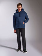 Alpinestars Emergent Oversized Hoodie, Navy Blue pullover fleece hoodie, tonal 3D logo embroidery on front, worn by model with black pants and sneakers, casual streetwear style.