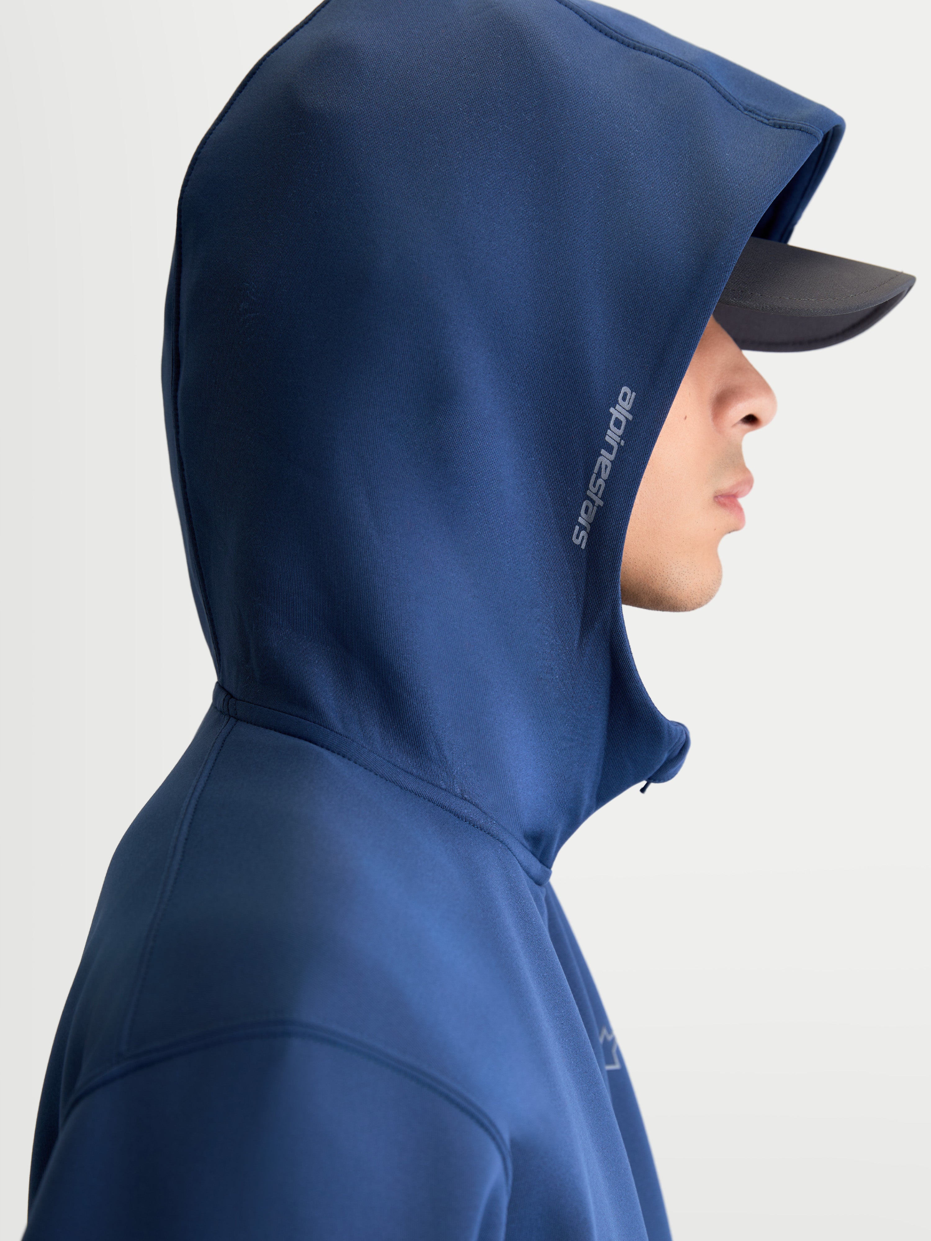 Alpinestars Cypher Hoodie, Men's Sportswear Zip-Front Fleece, Steel Blue, featuring a high-neck mesh-lined hood with side Alpinestars branding, on-model side view.