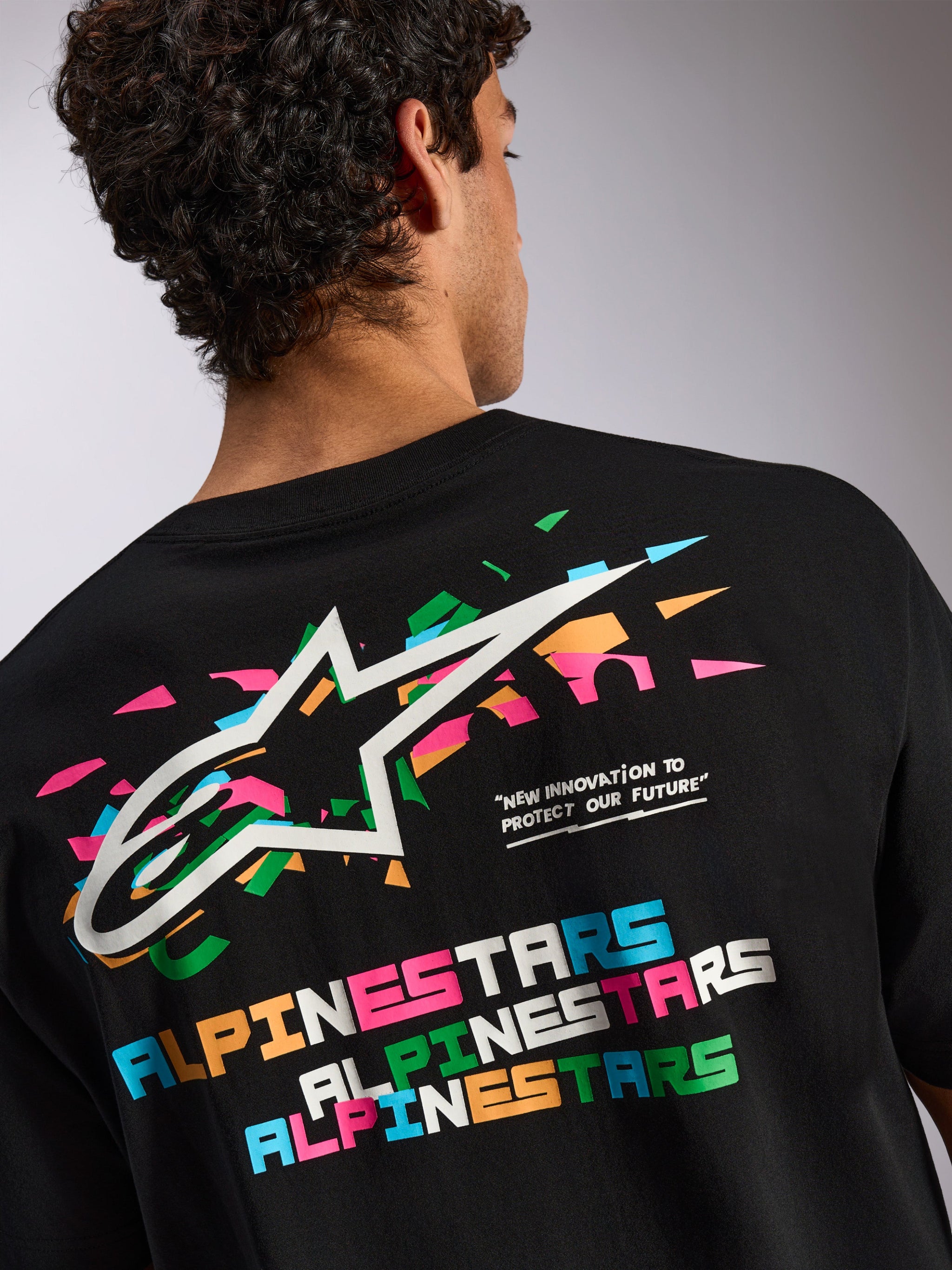 Alpinestars Wild Oversized CSF Tee, Short Sleeve T-Shirt, Black, Large back graphic with vibrant multi-colored Astars logo and typography, Casual Sportswear