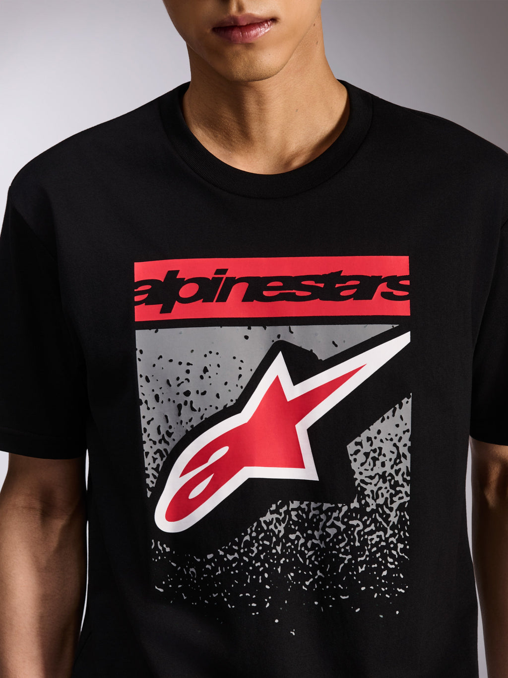 Alpinestars Noka CSF Tee, Short Sleeve T-Shirt, Black, Front Graphic with Red Alpinestars Wordmark and Red and White Astars Logo on Grey MX Gradation, Casual Motorsport Streetwear