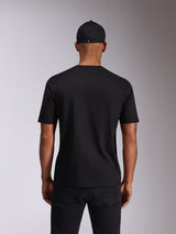 Alpinestars Ellipsoid CSF Tee, Short Sleeve T-Shirt, Black, Back view on model, worn with a black cap and dark trousers, casual motorsport-inspired streetwear