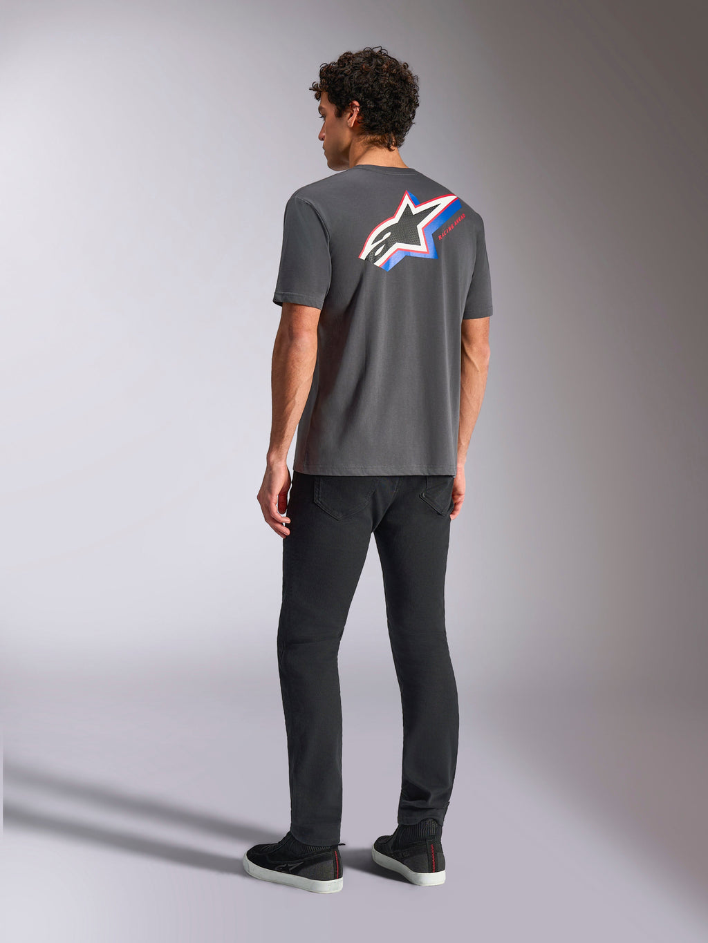 Alpinestars Angler CSF Tee, Short Sleeve T-Shirt, Charcoal, vibrant multi-color Astars logo on back with red and blue stripes, casual motorsport streetwear