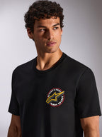 Alpinestars Aorbit CSF Tee, Short Sleeve T-Shirt, Black, Always Fast Made to Last circular chest graphic with yellow Astars logo, worn by model, Casual Motorsport Streetwear