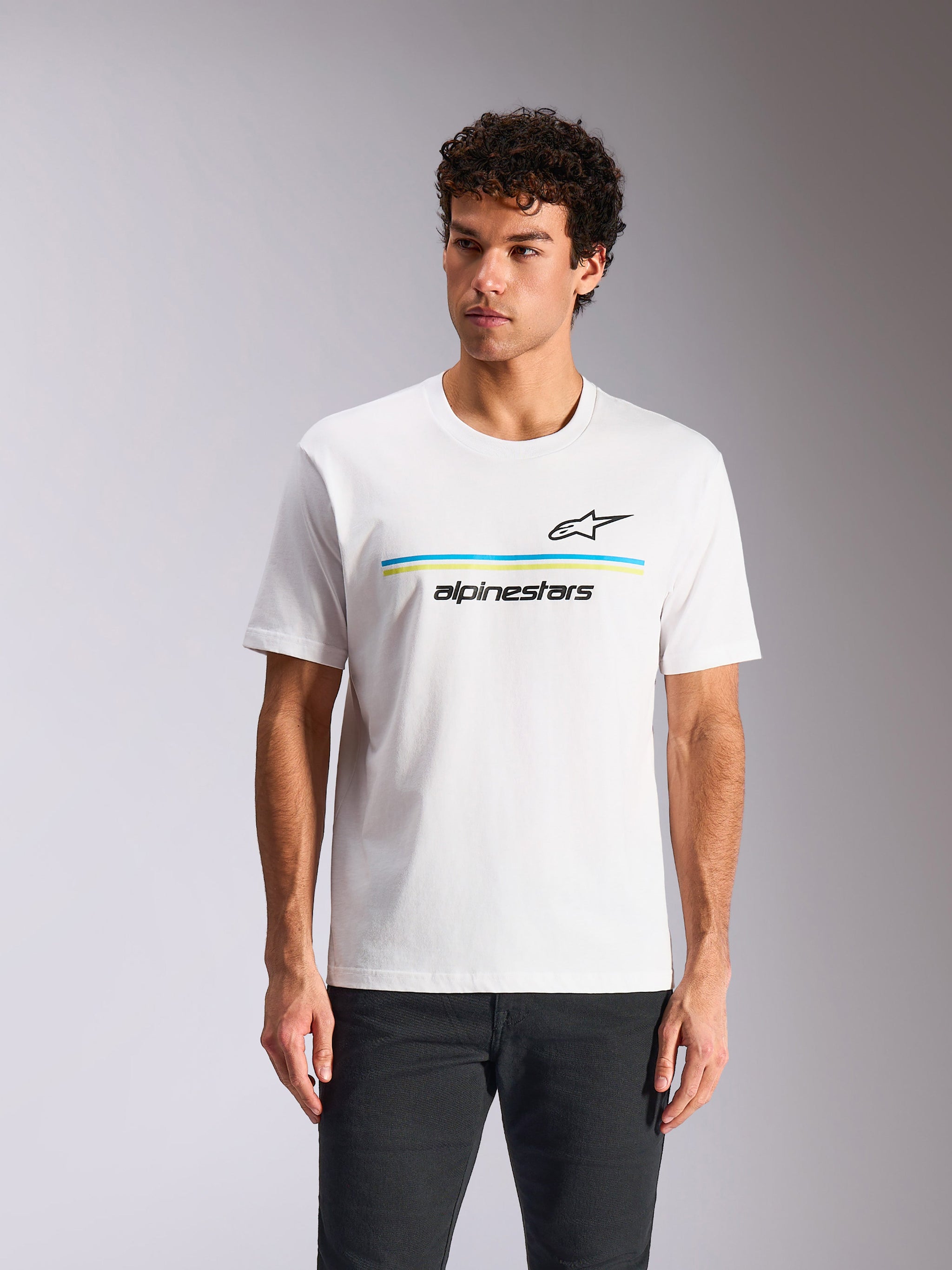 Alpinestars Lanes CSF Tee, Short Sleeve T-Shirt, White, featuring black Astars logo above blue and lime green horizontal stripes and 'alpinestars' text, worn by model, casual motorsport streetwear