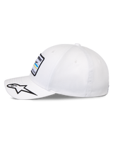 Alpinestars Surpass Hat, Structured Baseball Cap, White, curved bill with embroidered black and white star logo, side profile view showing front Astars logo patch, casual motorsport-inspired headwear