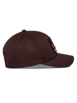 Alpinestars Matrix Snapback Hat, Dark Brown, side view featuring curved bill, structured crown, and front logo patch with rope detail, casual motorsport-inspired headwear