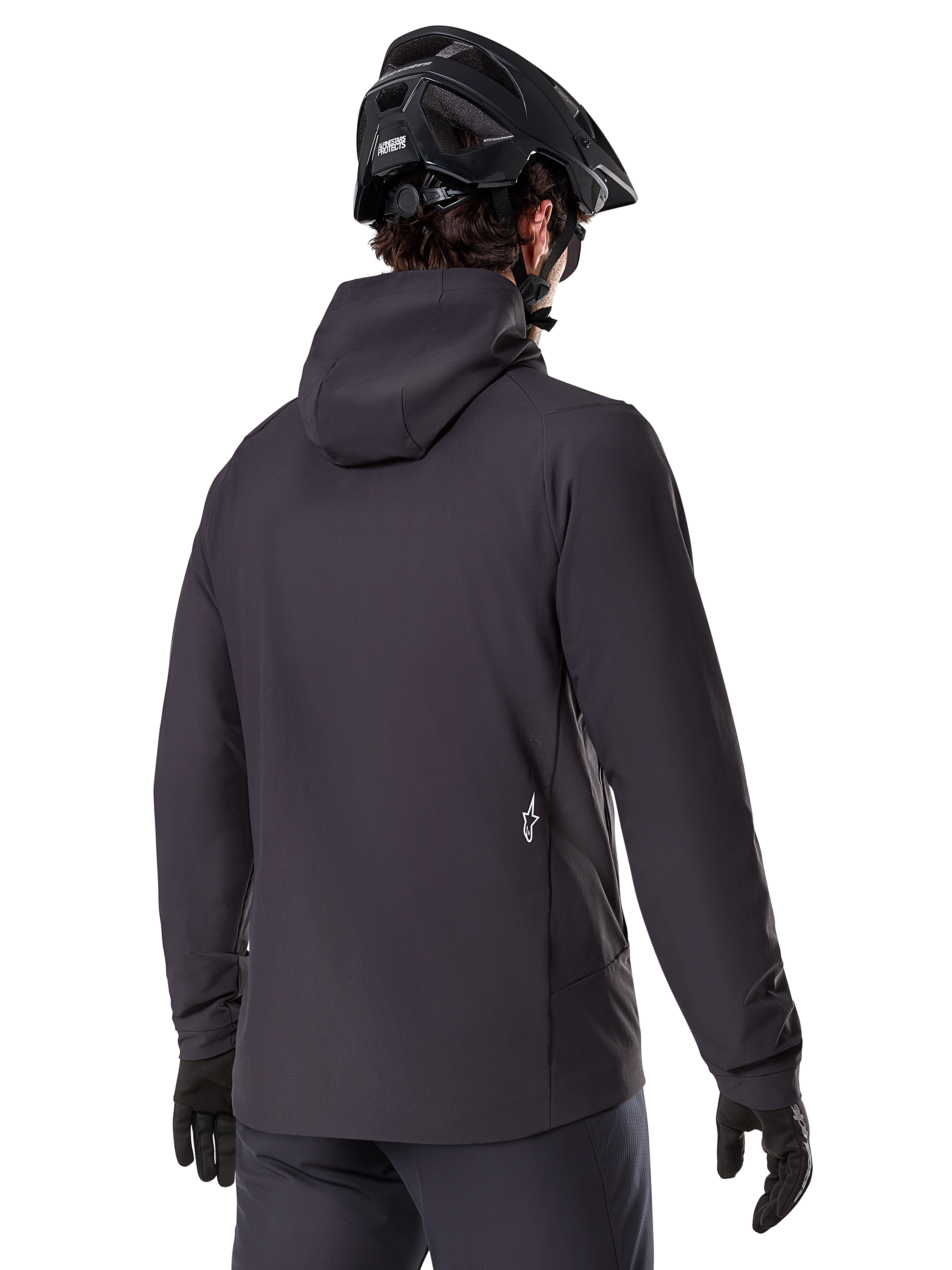 Alpinestars A-Dura Thermal Jacket, Black, back view, worn with a black mountain bike helmet and gloves, features a small white Astars logo on the lower back, lightweight insulated cycling jacket