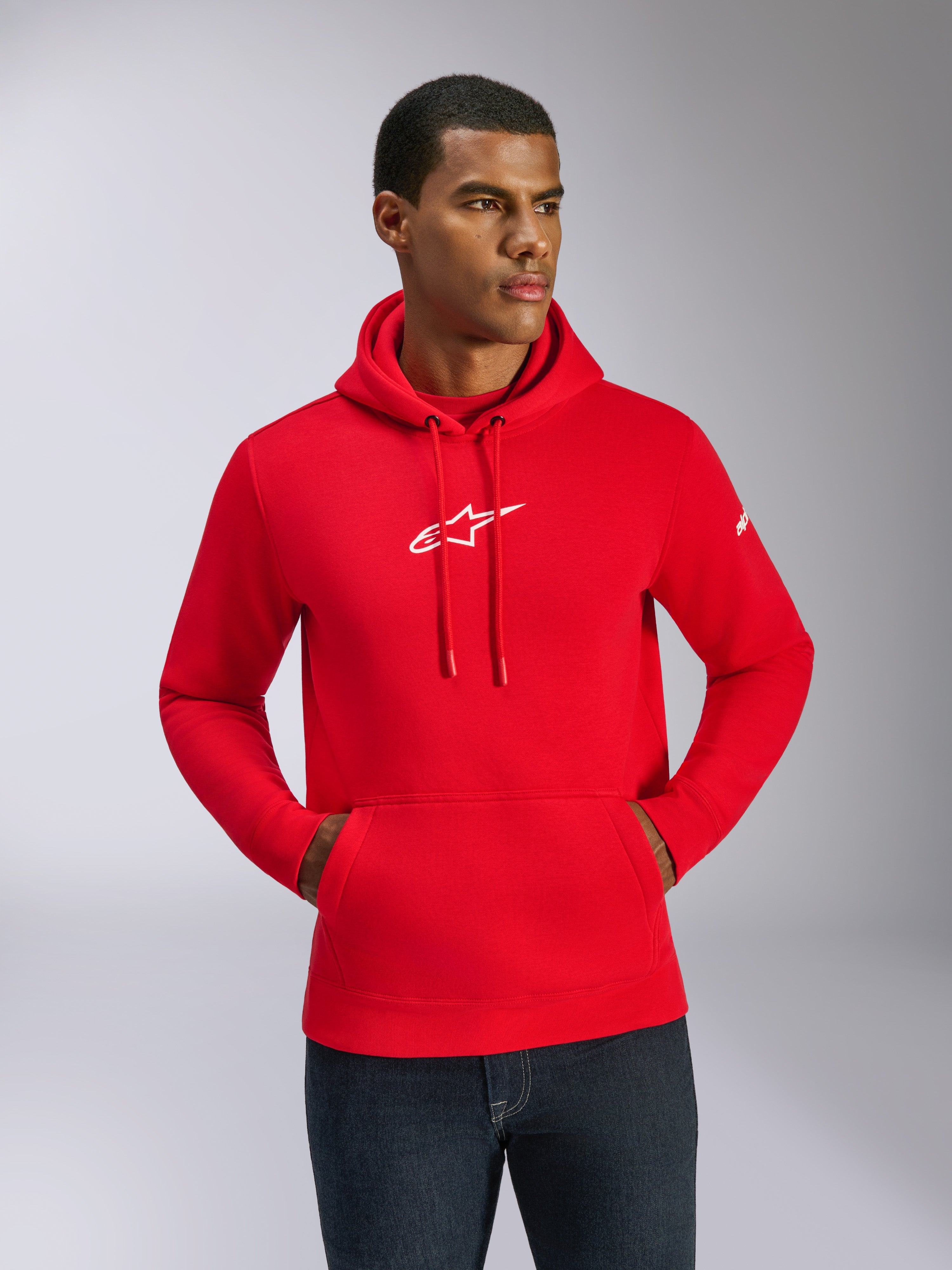 Alpinestars Frontal Hoodie, Red with White Logo, Male model wearing pullover fleece with front kangaroo pocket and adjustable drawstrings, casual motorsport streetwear