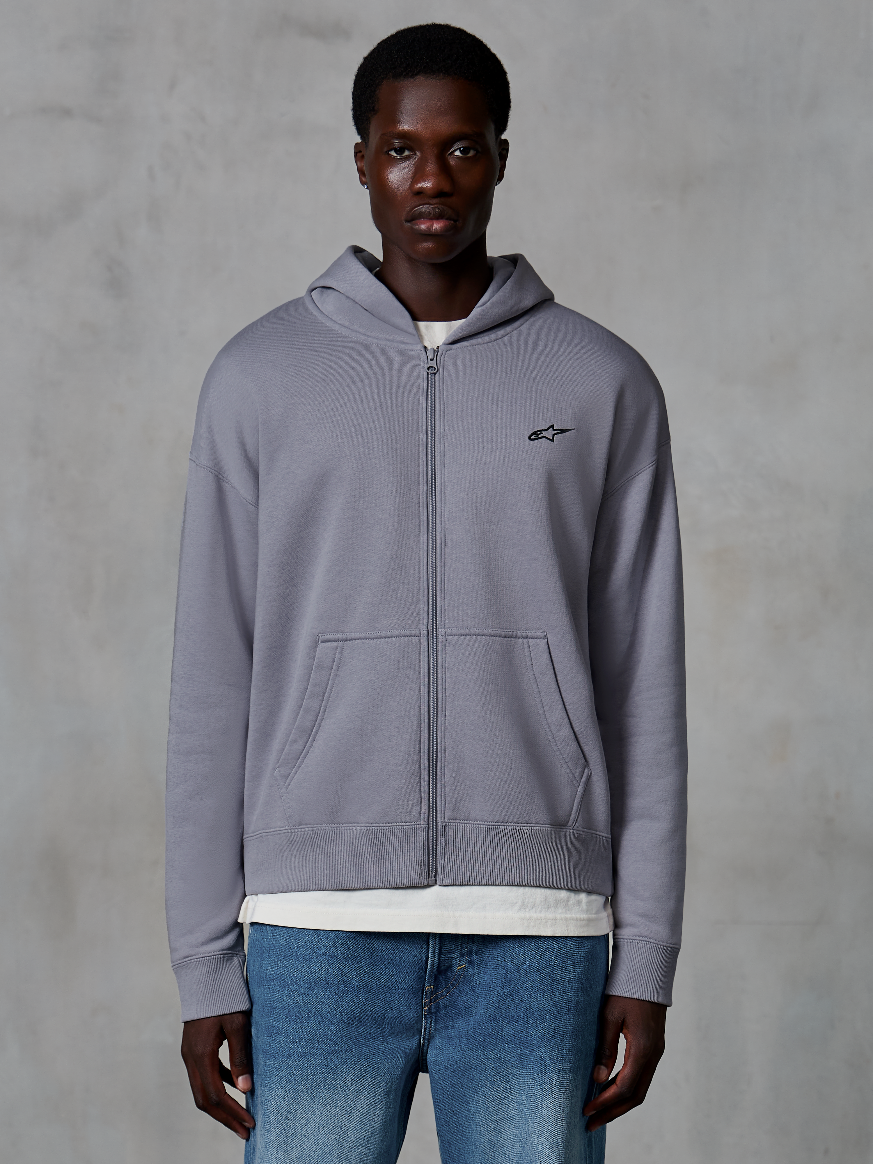 Alpinestars Essentials Ageless Zip Hoodie, Silver, casual streetwear worn by model, full-zip fleece with small black Astars logo on the chest, kangaroo pockets, relaxed fit design