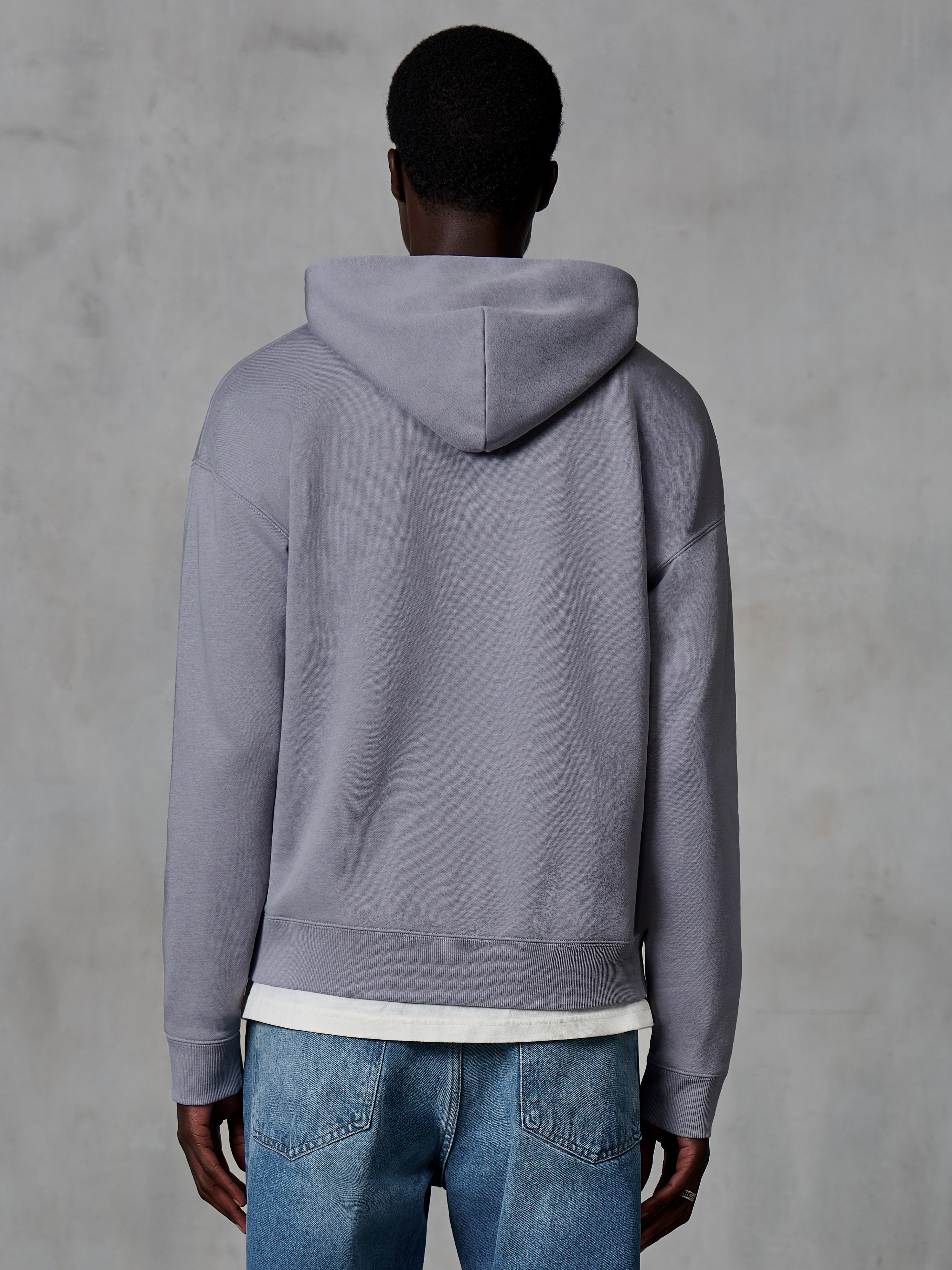 Alpinestars Essentials Ageless Zip Hoodie, Silver, back view, casual streetwear, relaxed fit with garment stone wash finish, paired with blue jeans and white undershirt