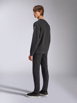 Alpinestars Bettern Crew, Fleece Pullover, Black, male model shown from a back and side angle, featuring ribbed cuffs and hem with a small logo on the sleeve, casual motorsport-inspired streetwear