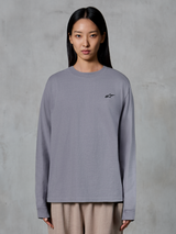 Alpinestars Essentials Ageless LS Tee, Long Sleeve T-Shirt, Silver, featuring a small black star logo on the chest, relaxed fit, premium organic cotton, casual motorsport-inspired streetwear