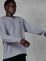 Alpinestars Essentials Ageless LS Tee, Long Sleeve T-Shirt, Silver, small black logo on chest, casual motorsport-inspired streetwear, worn by a model against a gray textured background