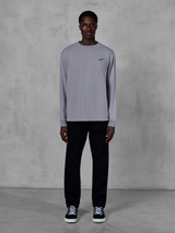 Alpinestars Essentials Ageless LS Tee, Long Sleeve T-Shirt, Silver, small black Alpinestars logo on the chest, organic cotton jersey with stone wash finish, worn by a model with black pants and sneakers, casual streetwear