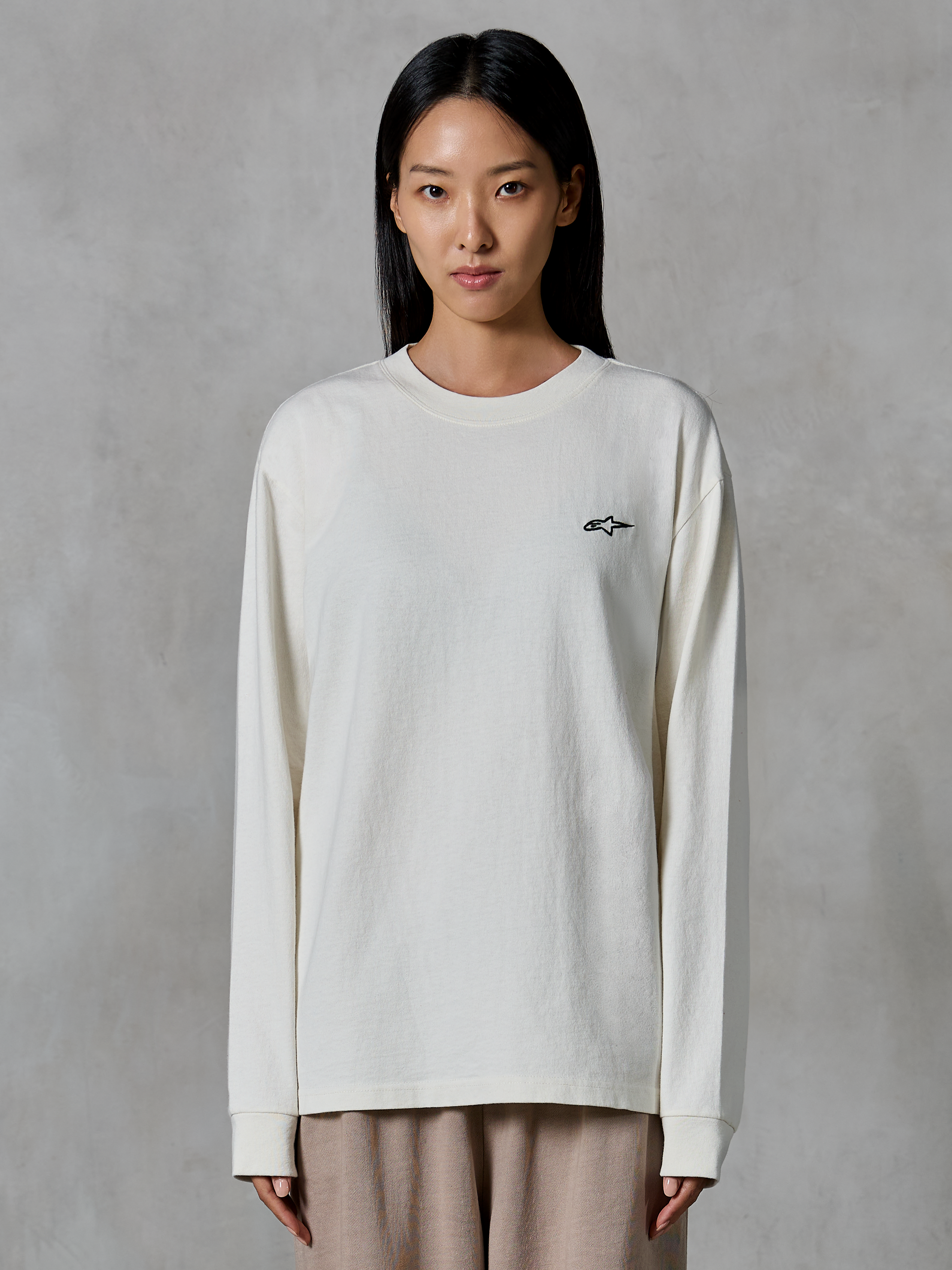 Alpinestars Essentials Ageless LS Tee, Long-Sleeve T-Shirt, Off White, featuring a small black star logo on the chest, relaxed contemporary fit, organic cotton jersey, casual motorsport-inspired streetwear