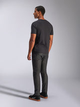 Alpinestars Tech Boot CSF Tee, Short Sleeve T-Shirt, Black, rear view on model, worn with dark gray denim pants and black sneakers, casual motorsport streetwear