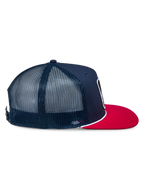 Alpinestars Control Trucker Hat, Navy and Red, Side profile view showing navy twill front and mesh back panels, flat red bill with white braided rope detail, casual motorsport-inspired headwear
