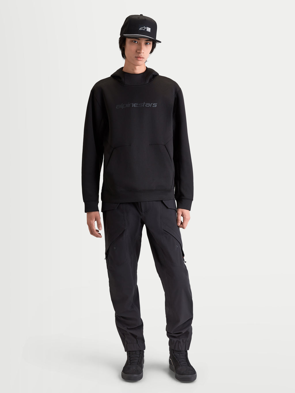 Alpinestars Datrix Hoodie, Premium Sportswear Pullover for Everyday Comfort and Motorsport Style, Men's, Black, constructed from tri-blend double-face fleece with tonal HD branding, a mesh-lined hood, and a dart-detail pocket, shown on-model for a clean, streamlined fit.