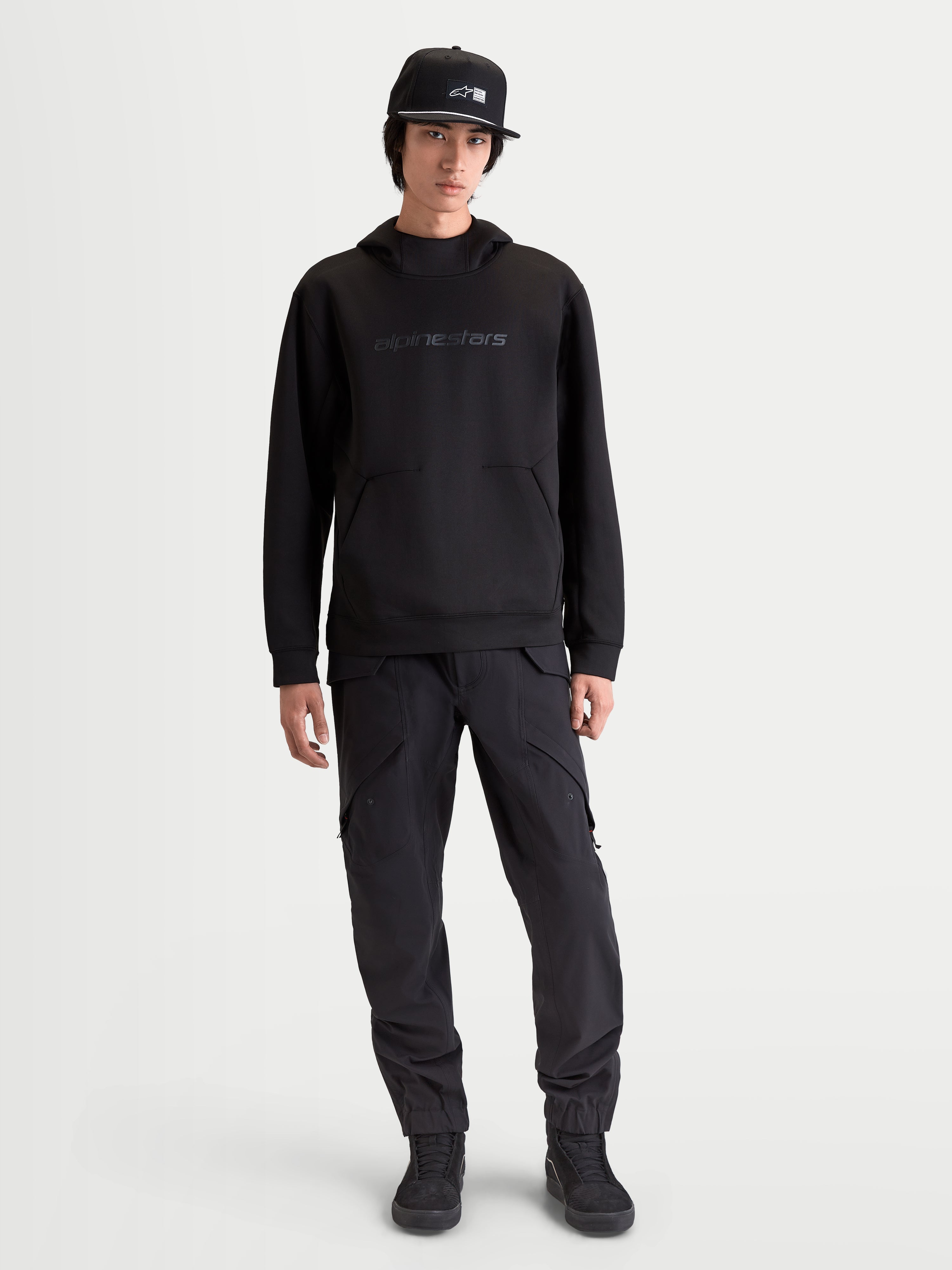 Alpinestars Datrix Hoodie, Premium Sportswear Pullover for Everyday Comfort and Motorsport Style, Men's, Black, constructed from tri-blend double-face fleece with tonal HD branding, a mesh-lined hood, and a dart-detail pocket, shown on-model for a clean, streamlined fit.