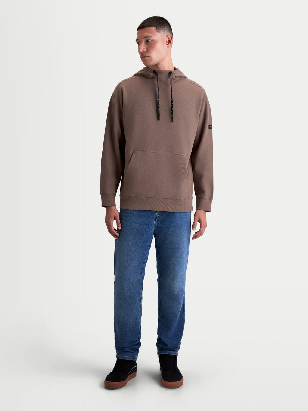 Alpinestars Camino Textured Oversized Hoodie, Men's Sportswear Pullover, Brown, featuring textured knit twill fleece, a high collar with drawcords, and a kangaroo pocket in a relaxed silhouette.