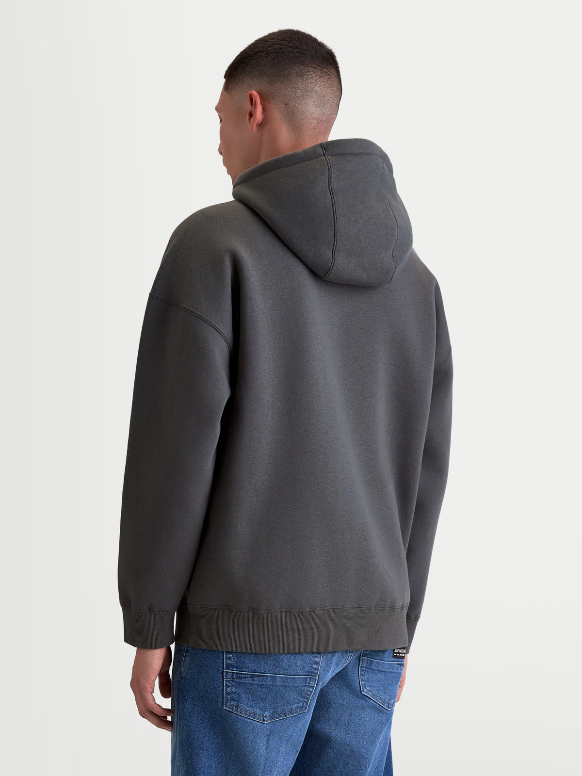 Alpinestars Prelude Oversized Hoodie, Casual Sportswear Pullover for Men and Women, Charcoal Gray, featuring a relaxed oversized fit, self-lined hood, and ribbed cuffs, back view.