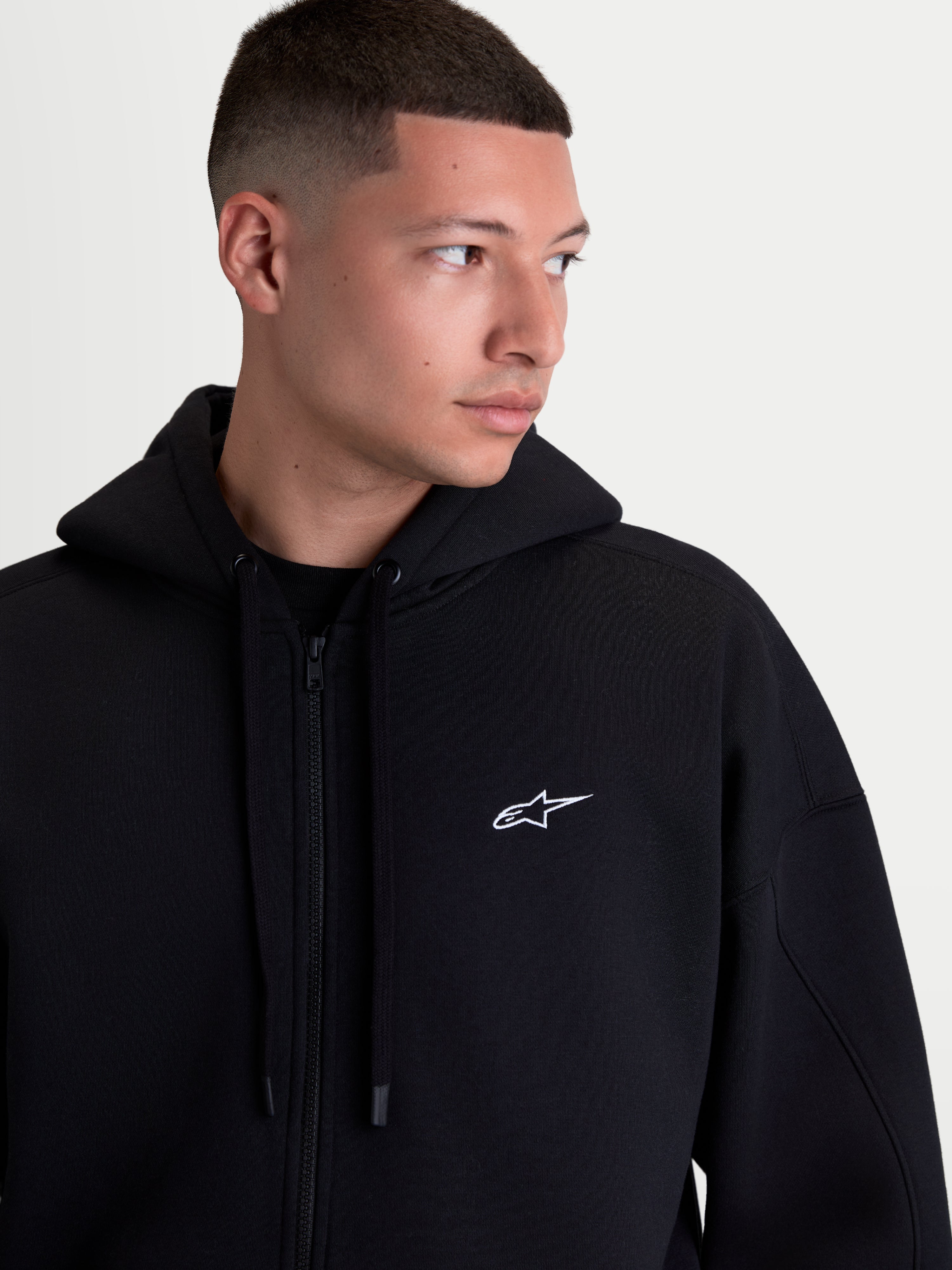 Alpinestars Pioneer Oversized Hoodie, Sportswear Zip-Up Fleece for Men and Women, Black with White Embroidered Logo, featuring a Relaxed Fit, Vislon Zipper, and Self-Lined Hood, Premium Cotton and Recycled Polyester Construction