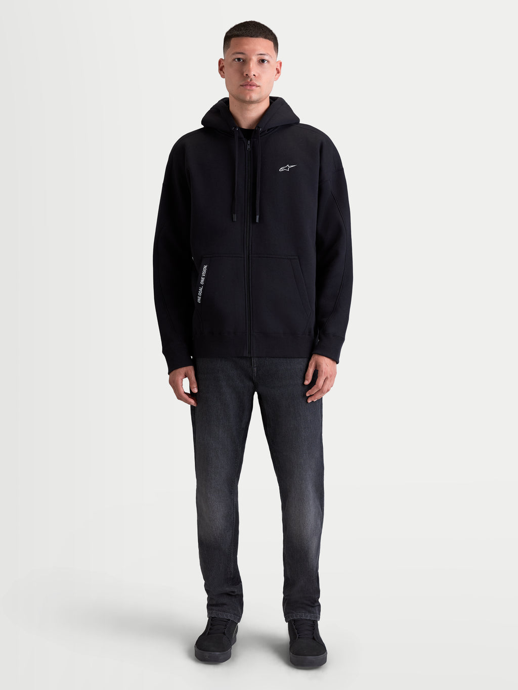 Alpinestars Pioneer Oversized Hoodie, Full-Zip Sportswear Fleece for Men and Women, Black, Featuring an Oversized Fit, Vislon Front Zipper, Kangaroo Pocket, and Embroidered Branding with 'One Goal. One Vision.' Detail.