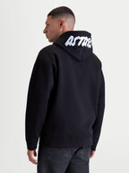 Alpinestars Pioneer Oversized Hoodie, Men's Sportswear Lifestyle Zip Fleece, Black and White, relaxed oversized fit, featuring white embroidered ASTARS branding on the hood, premium cotton-rich fleece construction, rear view on model.